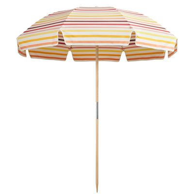 Jardin Patio Umbrella in Amore Stripe Gelato with UPF50+ protection, elegant fringing, and durable, water-resistant fabric.